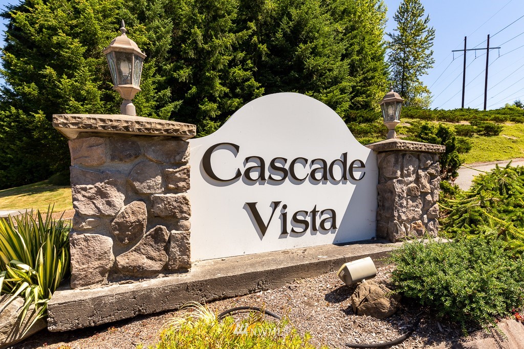 3318 206th Place Southeast Bothell, WA 98012 - Photo 2 of 35 a view of outdoor space with signage and flags