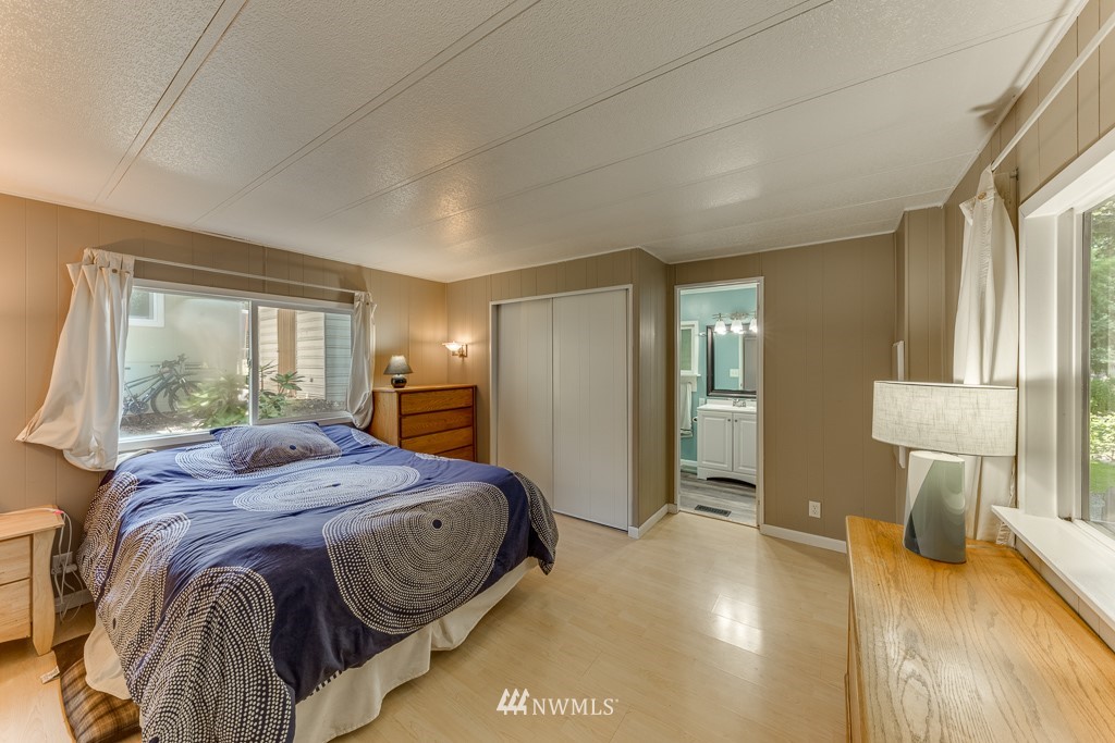 3318 206th Place Southeast Bothell, WA 98012 - Photo 12 of 35 a bedroom with a bed and a window