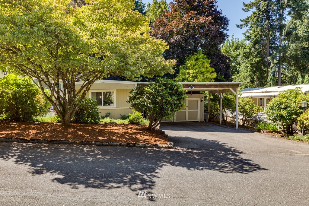 3318 206th Place Southeast Bothell, WA 98012 - Photo 3 of 35 a front view of a house with a garden