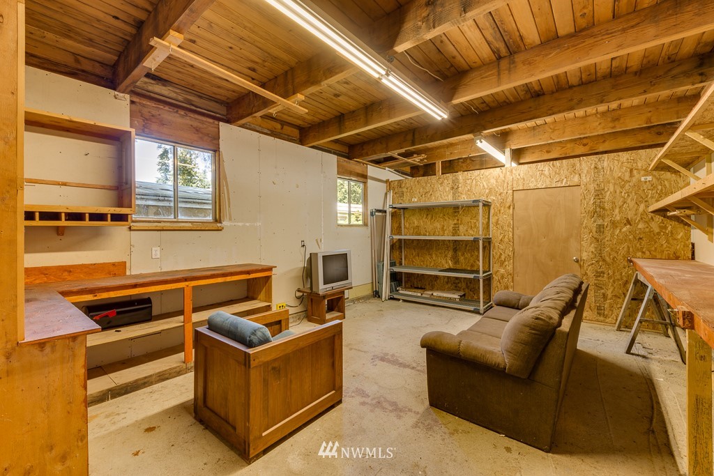 3318 206th Place Southeast Bothell, WA 98012 - Photo 27 of 35 a work room with furniture and a ceiling fan