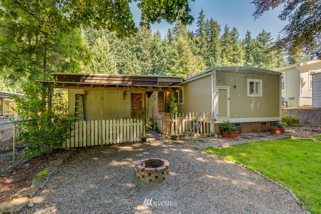 3318 206th Place Southeast Bothell, WA 98012 - Photo 29 of 35 a front view of a house with a yard