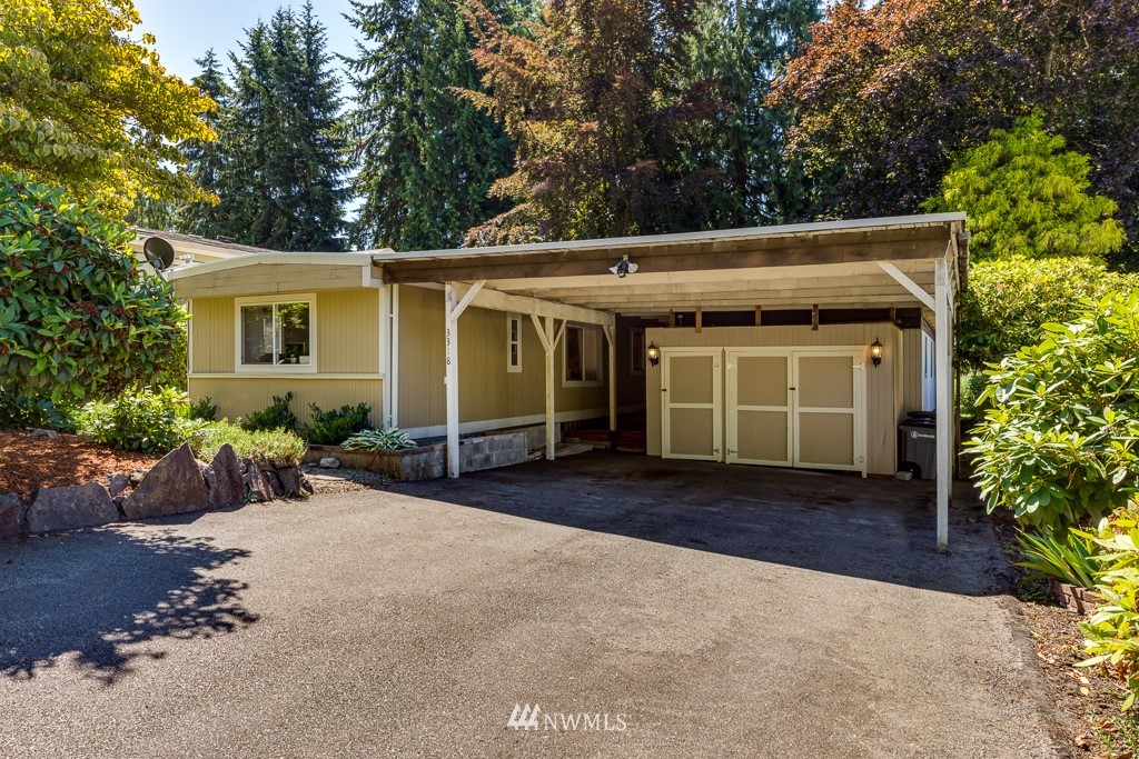 3318 206th Place Southeast Bothell, WA 98012 - Photo 30 of 35 a front view of a house with garden