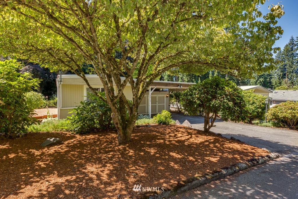 3318 206th Place Southeast Bothell, WA 98012 - Photo 32 of 35 a front view of a house with a tree