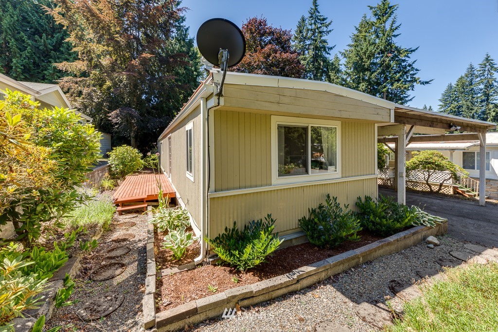 3318 206th Place Southeast Bothell, WA 98012 - Photo 6 of 35 a front view of a house with garden