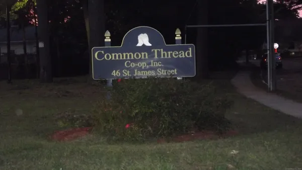 a view of outdoor space with signage and flags