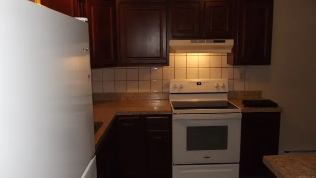 a kitchen with a stove and a microwave