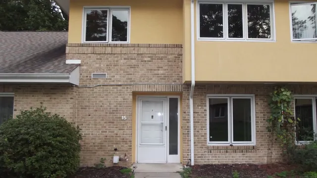 front view of a brick house with a large windows