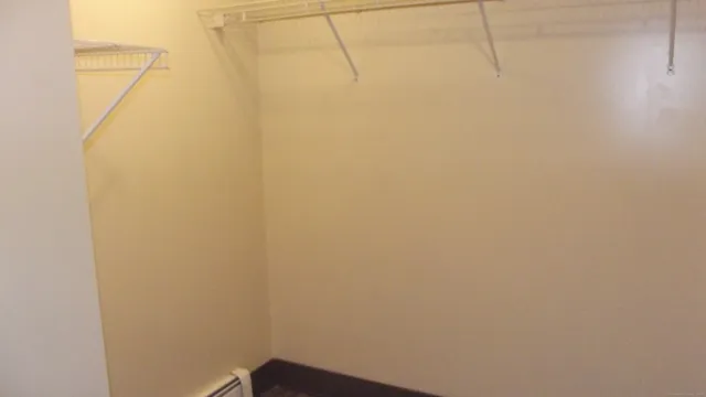 a view of a small space with wooden floor