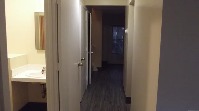 a view of a bathroom from a hallway