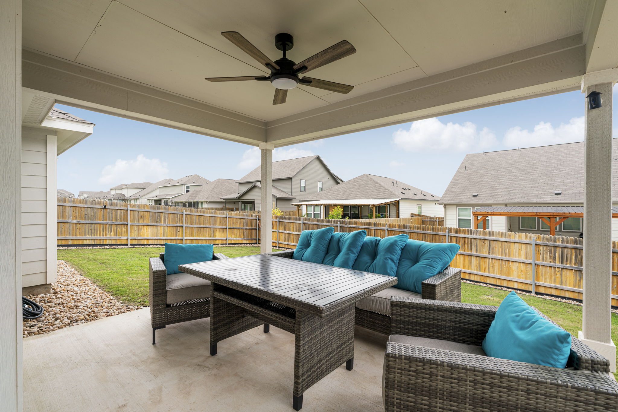 19412 Forman Drive Pflugerville, TX 78660 - Photo 27 of 34 The extended covered patio provides a comfortable outdoor living space perfect for relaxing or entertaining.
