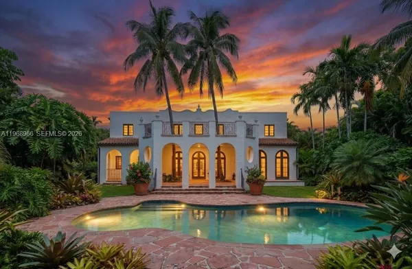 a swimming pool with outdoor seating and yard