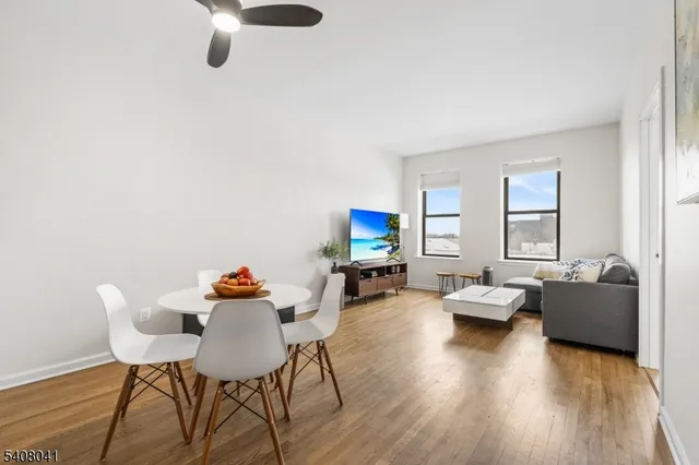 a work room with furniture and wooden floor
