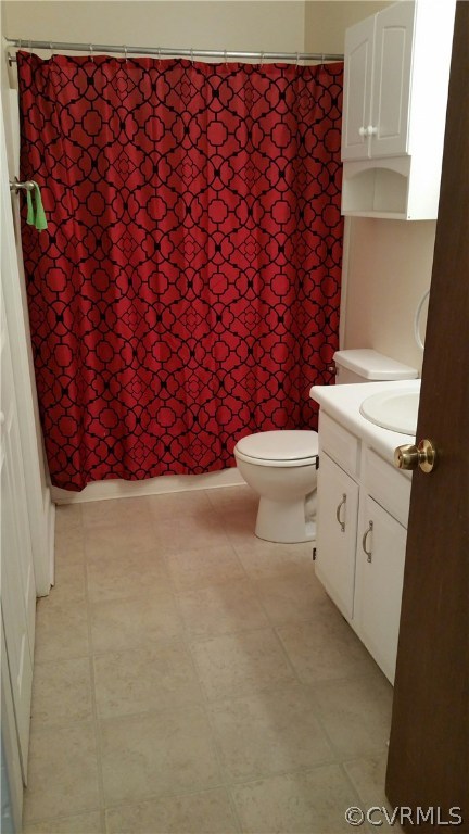 4800 Alberta Road Chesterfield, VA 23832 - Photo 15 of 19 a white toilet sitting next to a shower curtain