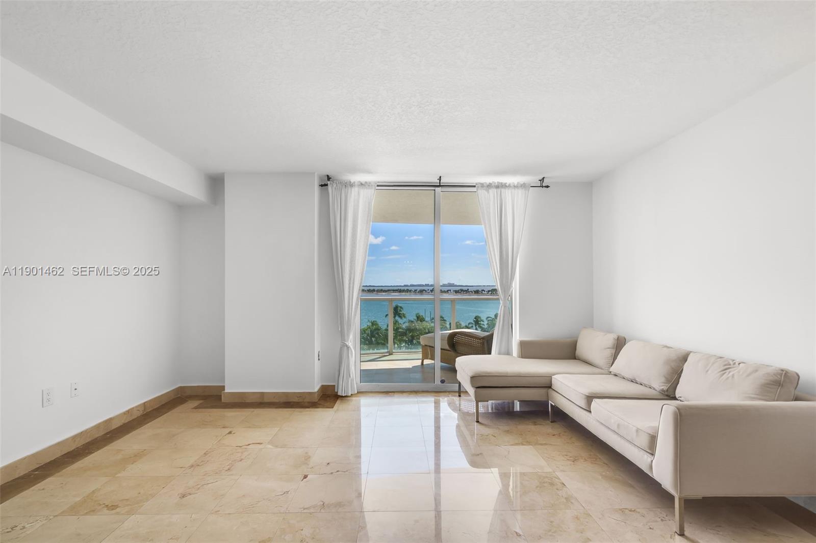 2101 Brickell Avenue, Unit 306 Miami, FL 33129 - Photo 30 of 49 a living room with furniture and a large window