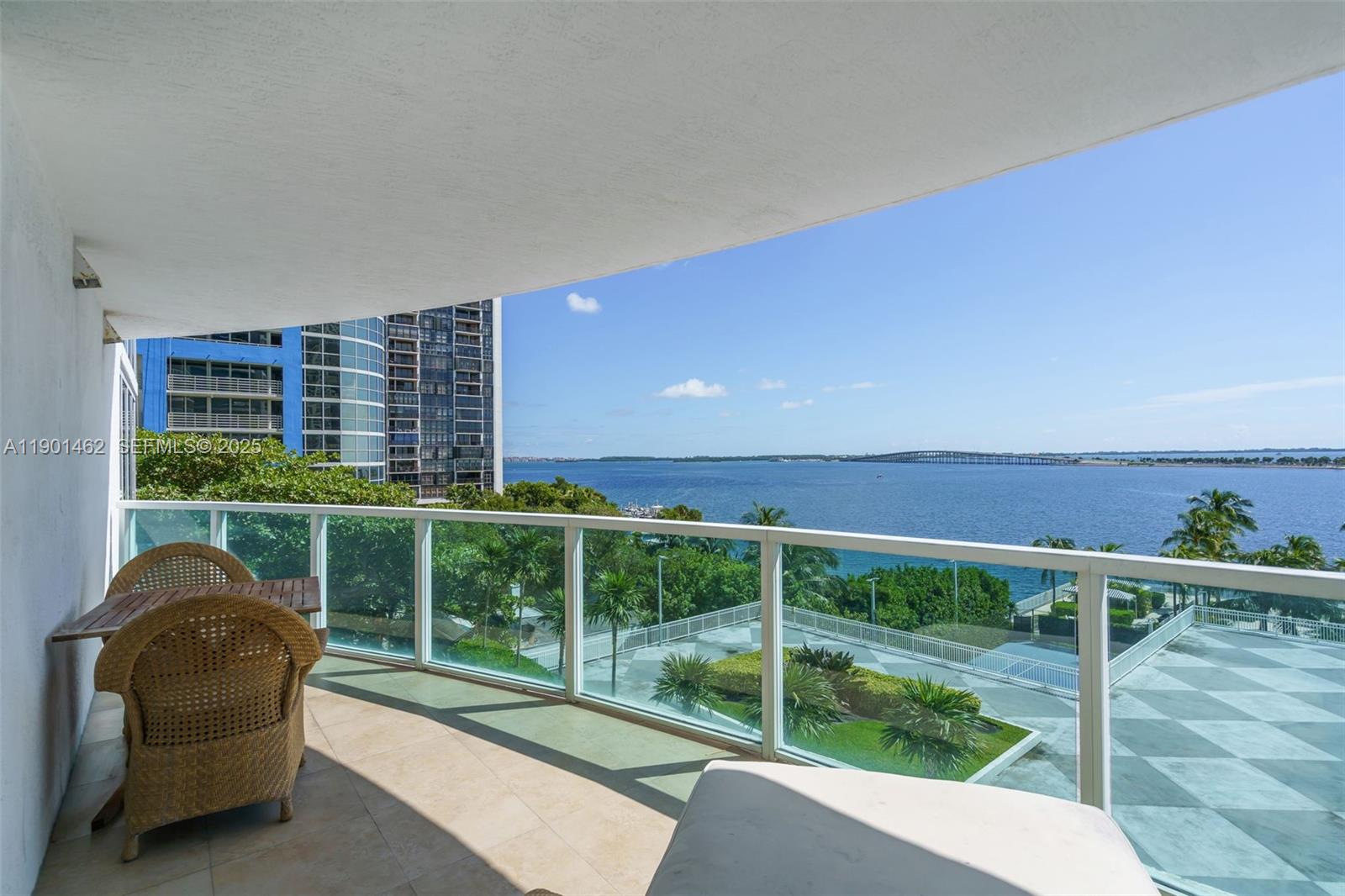 2101 Brickell Avenue, Unit 306 Miami, FL 33129 - Photo 3 of 49 a view of a deck with couches and wooden fence