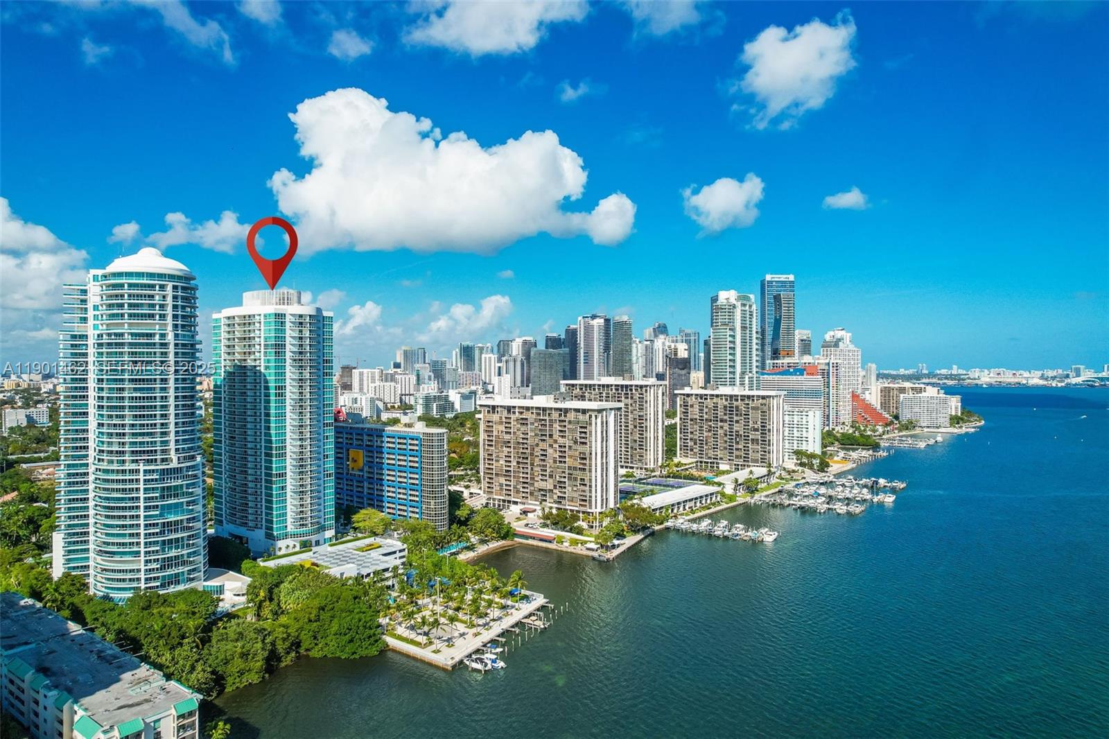 2101 Brickell Avenue, Unit 306 Miami, FL 33129 - Photo 46 of 49 a view of a balcony with dining table and chairs with plants