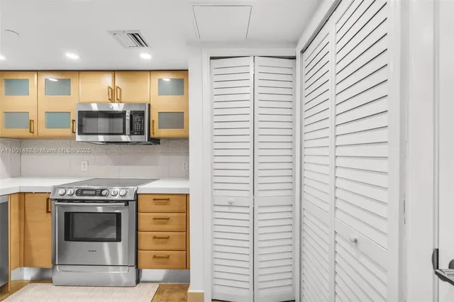 a kitchen with a sink and refrigerator