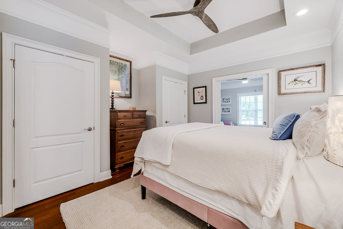 7272 Shellman Bluff Road Northeast, Unit 18 Townsend, GA 31331 - Photo 17 of 31 a bedroom with a bed and a window