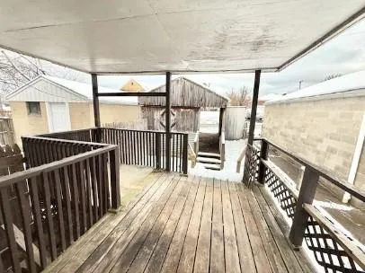 a view of balcony with wooden floor