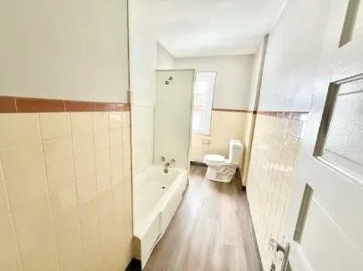 a spacious bathroom with a bathtub