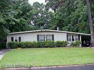 6960 Clovis Road Jacksonville, FL 32205 - Photo 1 of 1 a front view of a house with a yard