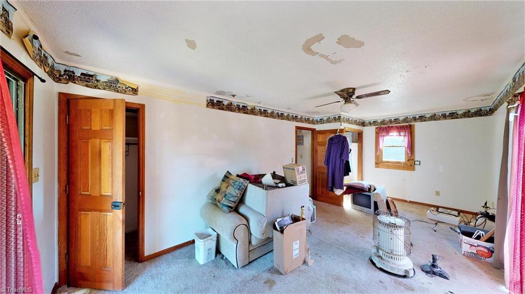 3834 Flynt Road Liberty, NC 27298 - Photo 15 of 40 Guest room with 2 closets & two sliding doors to balcony.
