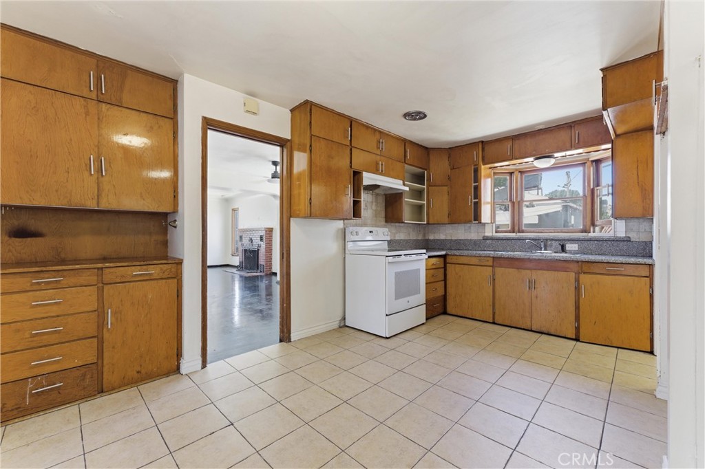 44509 Date Lancaster, CA 93534 - Photo 11 of 20 a kitchen with a sink cabinets and stainless steel appliances