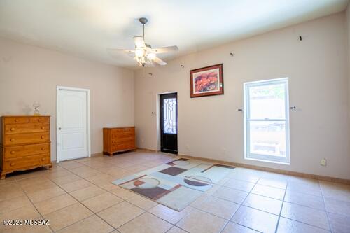 480 Camino Ramanote Rio Rico, AZ 85648 - Photo 14 of 43 Next down the hall to the east is the large primary bedroom and walk-in closet and east facing custom metalwork door.