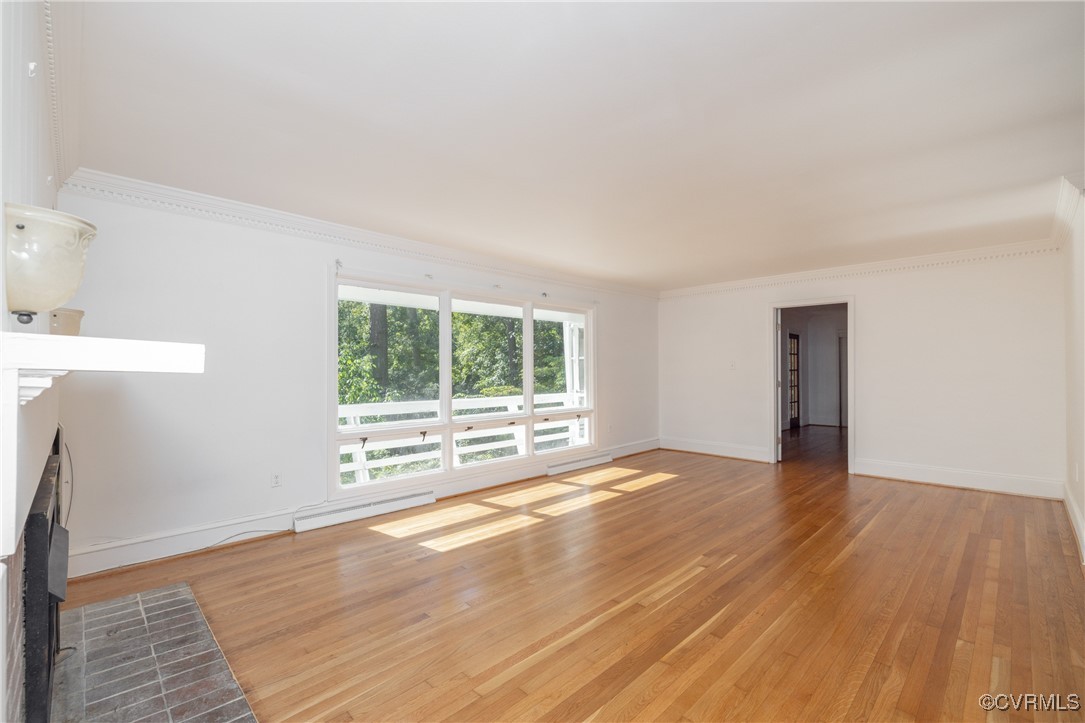 811 Forestview Drive Colonial Heights, VA 23834 - Photo 11 of 45 a view of an empty room with wooden floor and a window