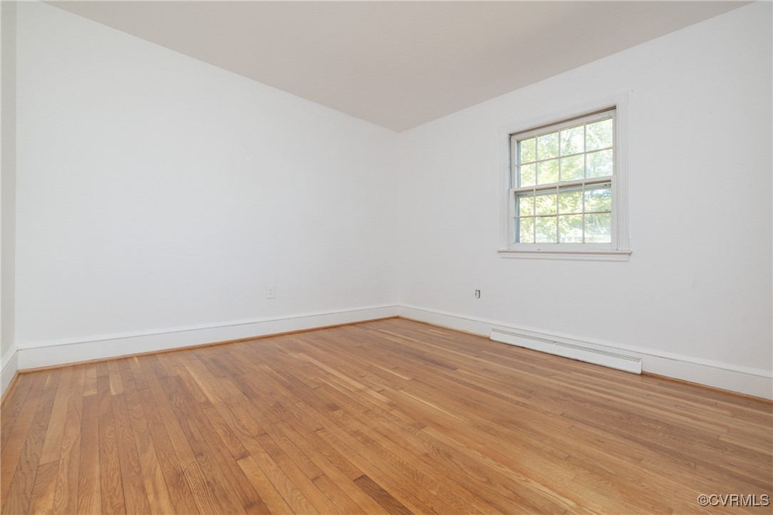 811 Forestview Drive Colonial Heights, VA 23834 - Photo 15 of 45 an empty room with wooden floor and windows