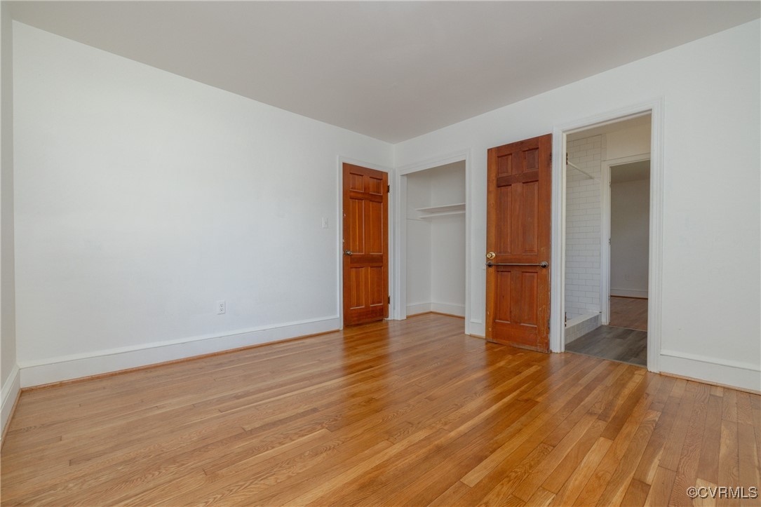 811 Forestview Drive Colonial Heights, VA 23834 - Photo 17 of 45 a view of an empty room with wooden floor and a window
