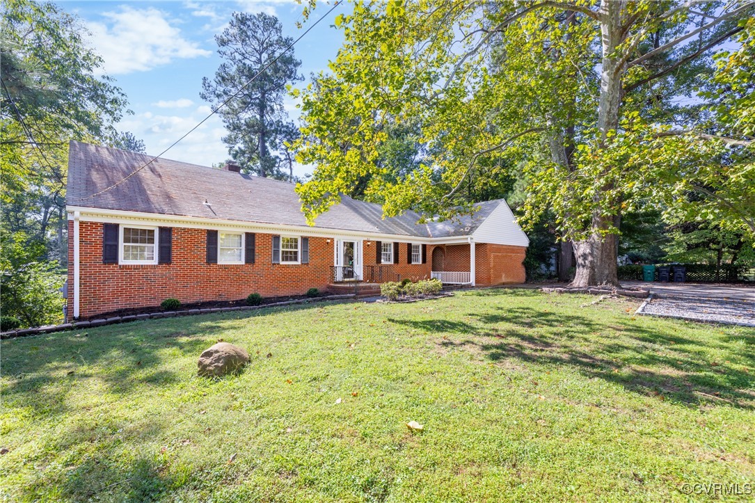 811 Forestview Drive Colonial Heights, VA 23834 - Photo 3 of 45 a front view of a house with a garden