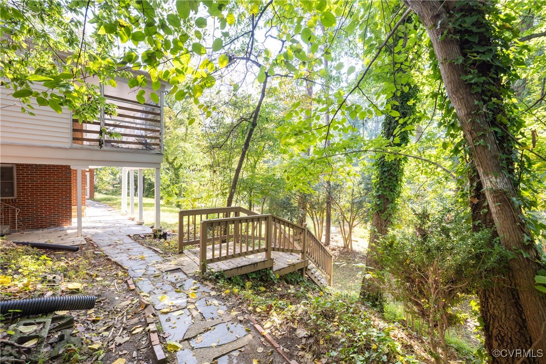 811 Forestview Drive Colonial Heights, VA 23834 - Photo 32 of 45 a view of a chair and tables in the back yard of the house