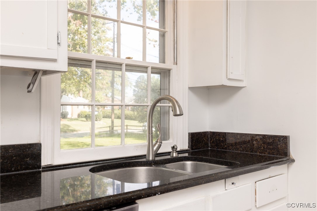 811 Forestview Drive Colonial Heights, VA 23834 - Photo 7 of 45 a kitchen with granite countertop a sink and a window