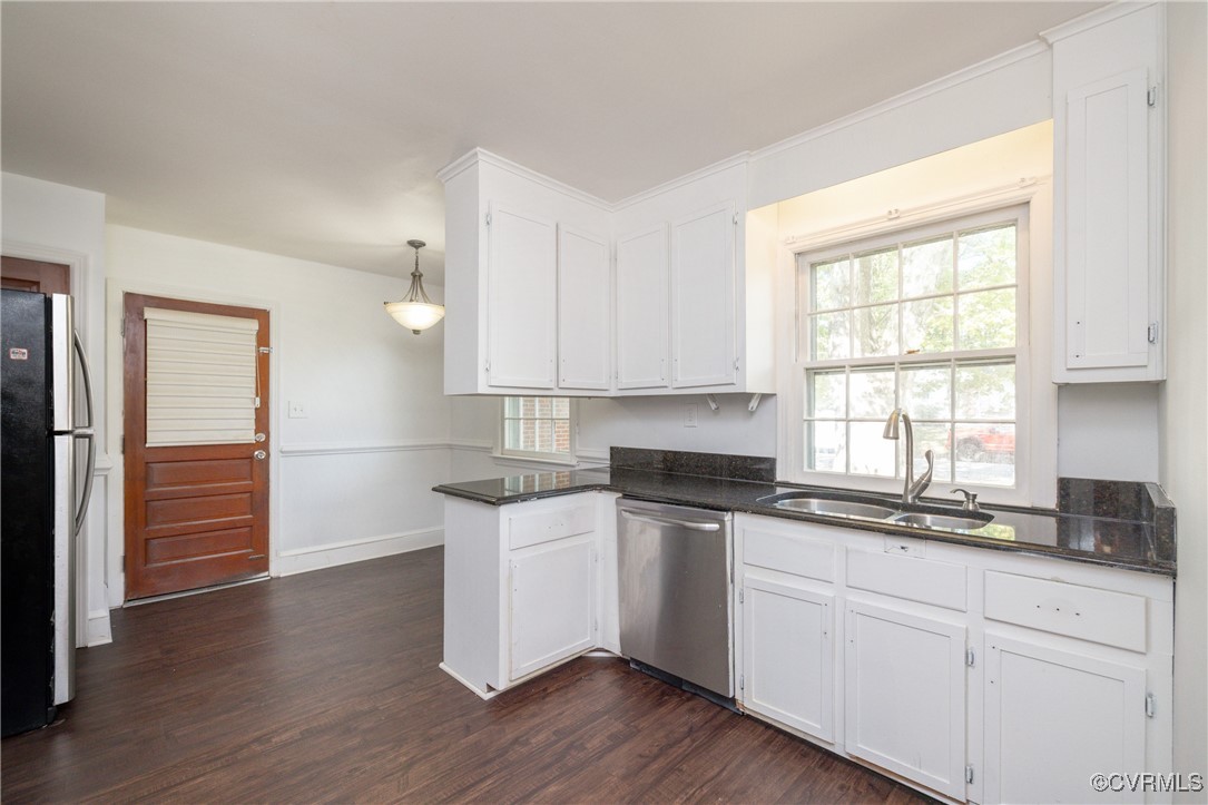 811 Forestview Drive Colonial Heights, VA 23834 - Photo 8 of 45 a kitchen with granite countertop white cabinets and white appliances