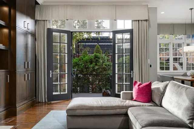 a kitchen with stainless steel appliances granite countertop a stove a sink and white cabinets