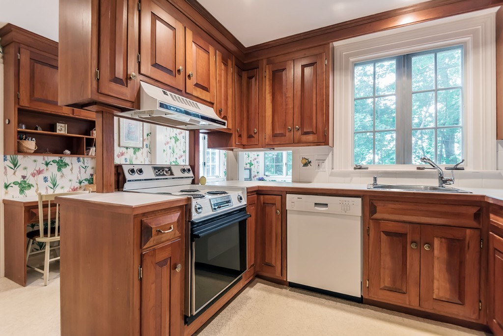 79 Cheever Circle Andover, MA 01810 - Photo 11 of 30 a kitchen with stainless steel appliances granite countertop a sink a stove and a refrigerator