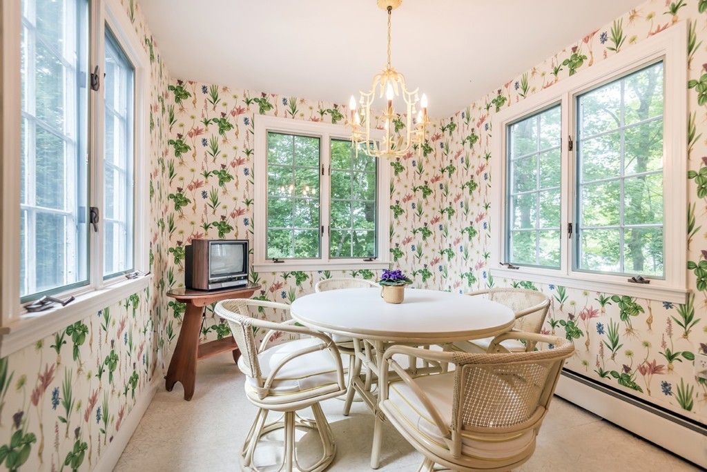 79 Cheever Circle Andover, MA 01810 - Photo 15 of 30 a dining room with furniture a chandelier and wooden floor