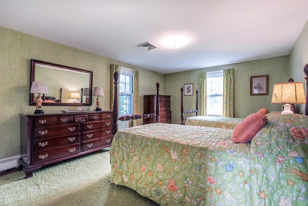 79 Cheever Circle Andover, MA 01810 - Photo 21 of 30 a bedroom with a bed and a dresser in it