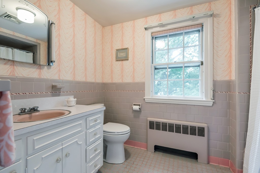 79 Cheever Circle Andover, MA 01810 - Photo 26 of 30 a bathroom with a toilet a sink a window and mirror