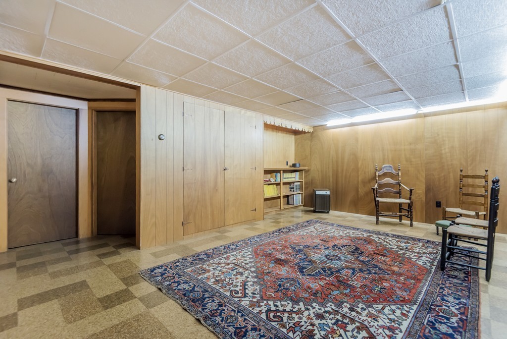 79 Cheever Circle Andover, MA 01810 - Photo 27 of 30 a spacious bedroom with a rug a desk and chair