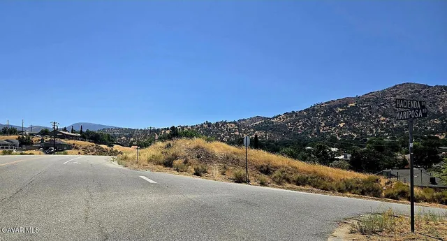 a view of a road with an ocean view