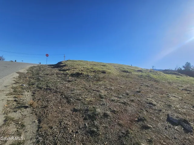 a view of a field with an outdoor space