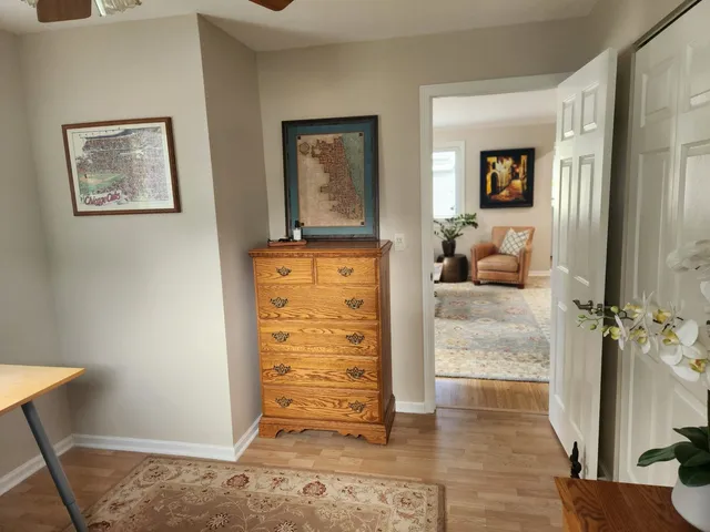 a bathroom with a sink mirror vanity and toilet