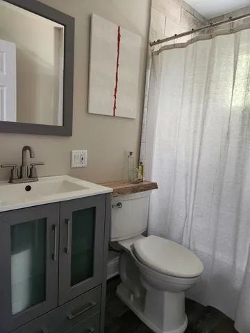 a bathroom with a toilet and a sink