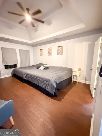 a bathroom with a toilet and a shower curtain