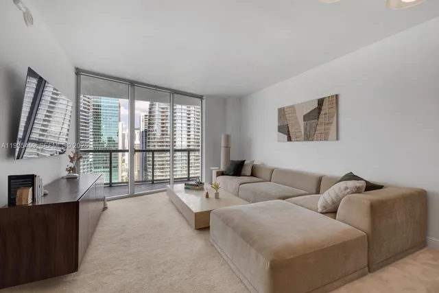 a view of a dining room with furniture and window