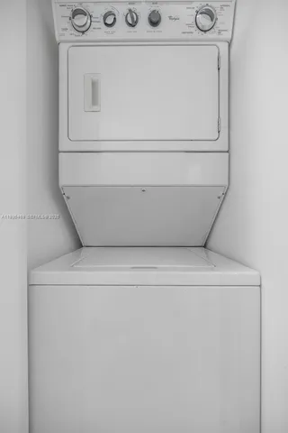 a kitchen with a sink and a refrigerator