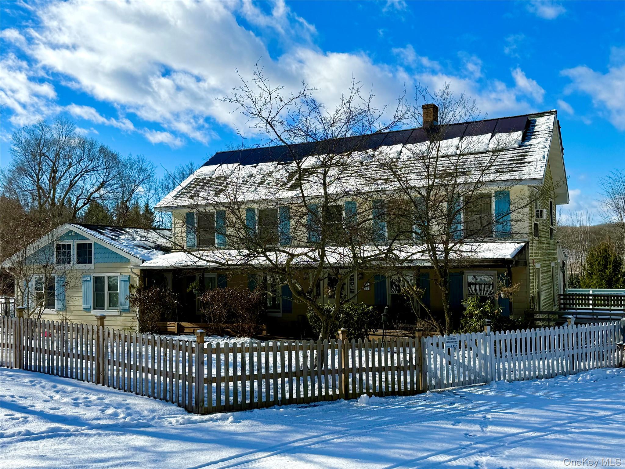 a view of a house with a iron gate