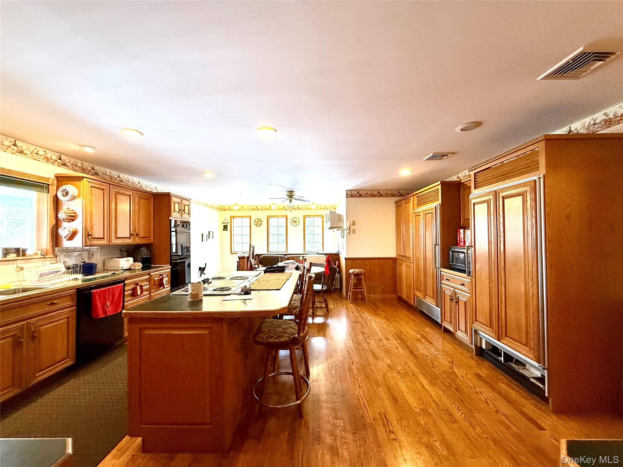 912-918 Hollow Road Salt Point, NY 12578 - Photo 3 of 29 a room with stainless steel appliances kitchen island granite countertop a stove and a refrigerator